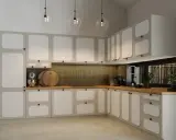 Nowoczesna kuchnia z jasnymi frontami i okrągłymi, czarnymi uchwytami. Idealne, jakie uchwyty do mebli kuchennych dla minimalistycznego wnętrza.