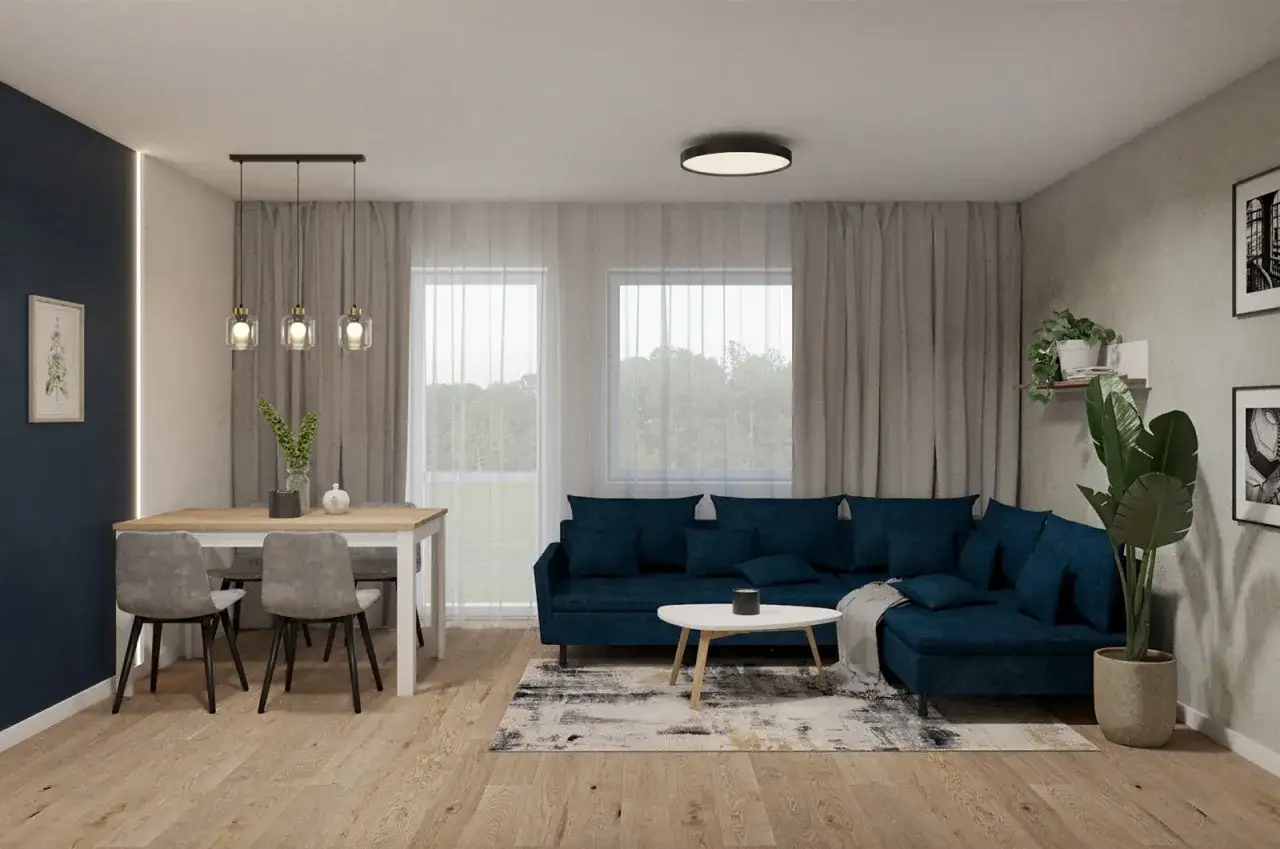 Nowoczesny salon z granatową kanapą i stołem. Dwie lampy wiszące nad stołem i jedna sufitowa tworzą przytulną atmosferę.
