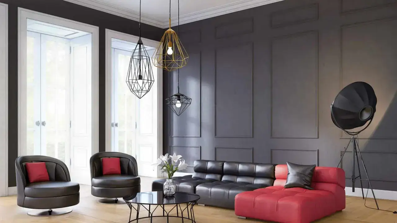 Nowoczesna sztukateria ścienna podkreśla elegancję salonu z czarną kanapą, czerwoną sofą i designerskimi lampami.
