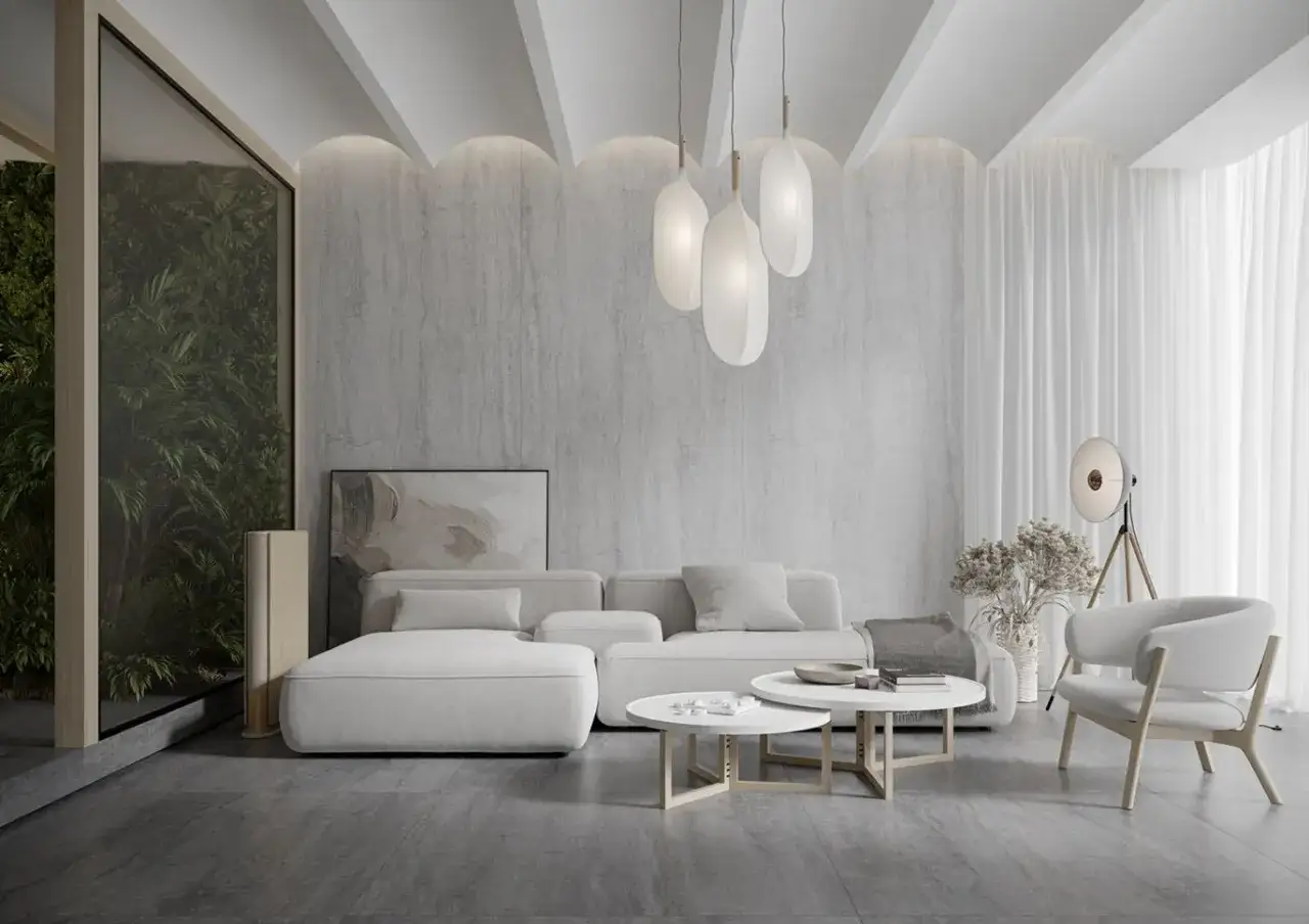 Nowoczesny salon z białymi meblami i kamienną ścianą. Łukowaty pomysł na sufit w pokoju z delikatnym podświetleniem tworzy przytulną atmosferę.