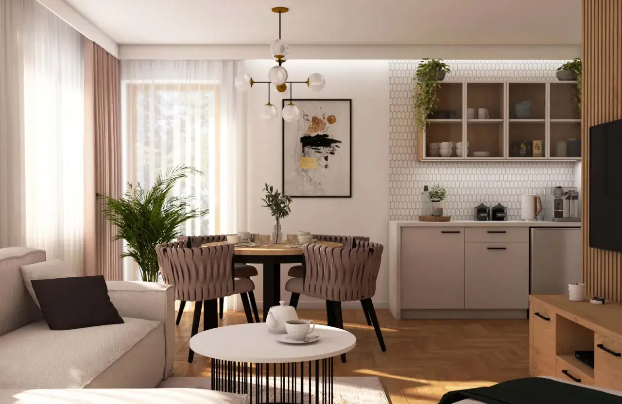 Nowoczesny salon z jadalnią. W centralnym punkcie znajduje się okrągły stół z krzesłami, a nad nim designerski żyrandol. To właśnie taki żyrandol, zamontowany na suficie, jest przykładem tego, co to jest kinkiet.